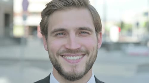 Close Up of Businessman Smiling at Camera Outdoor