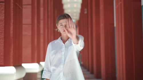 Businesswoman Showing Stop Gesture By Palm Hand