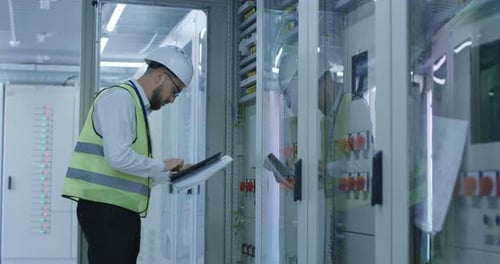 Man in Control Center of Solar Power Station