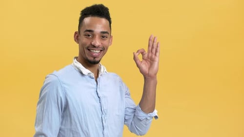 Young Adult Giving OK Hand Gesture