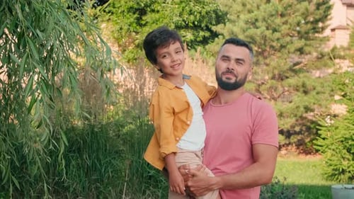Father and Son Bonding Moment in Suburban Garden