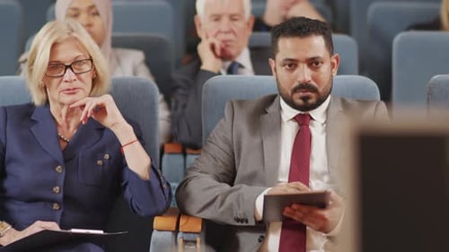 Diverse Group Attends Corporate Conference Presentation