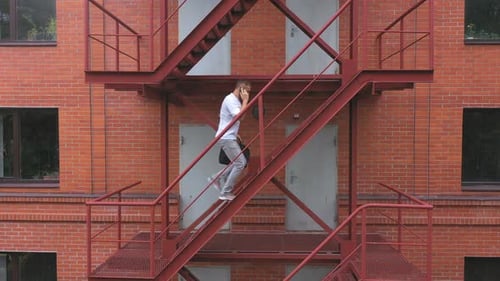 Businessman Climbing Up the Stairs of a Business Centre