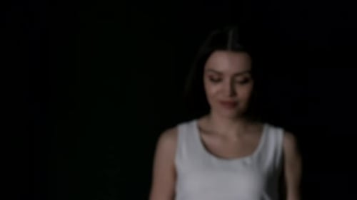 Pretty Caucasian Woman on Dark Background