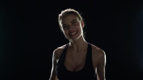 Excited Woman Celebrates Fitness Victory