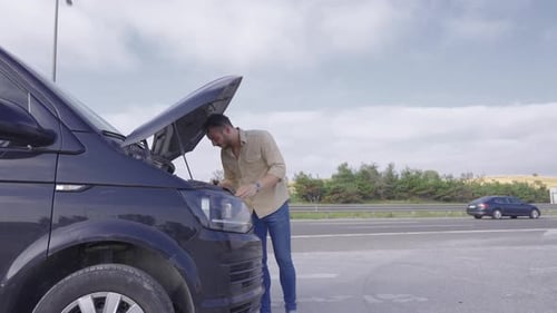 The person whose car broke down on the highway.