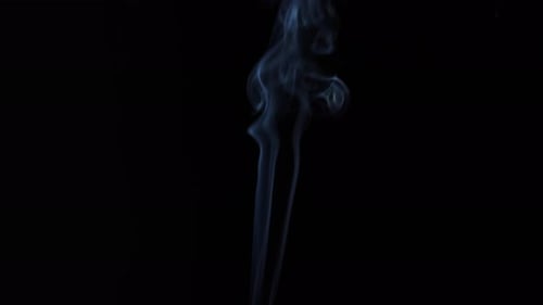 Blue Smoke Flowing on Black Background