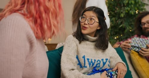 Friends Exchange Gifts at Christmas Party