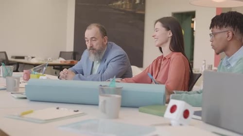 Diverse Colleagues Collaborate in Productive Meeting