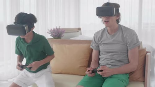 Child and Adult Playing Virtual Reality Game Together