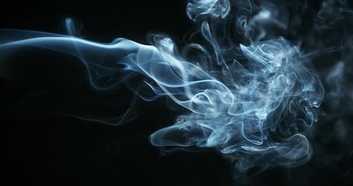 Ethereal Blue Smoke Flowing Across Black Background