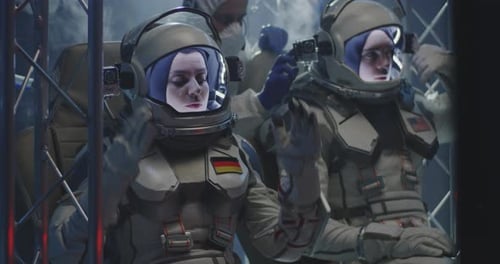Astronauts Prepare for Space Mission in Futuristic Suits