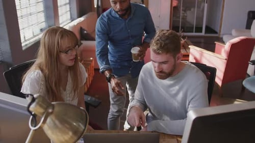 Young creative professionals working in a modern office