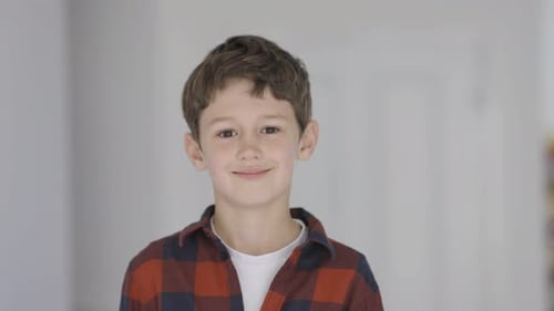 Smiling Boy Posing for a Portrait Indoors