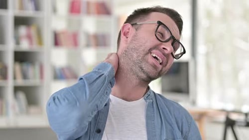 Adult Rubbing Neck in Pain