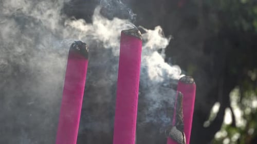 Burning Incense Sticks with Smoke Outdoors
