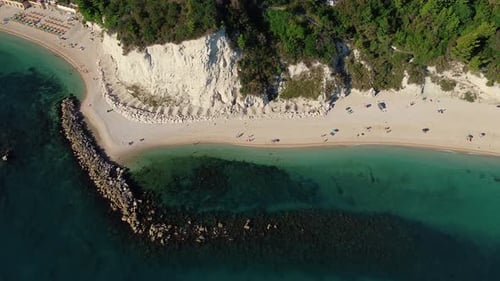 Flying Over Seashore with Beach and Mountainous Surface