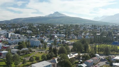 Beautiful Scenery of Snow Capped Mountain Peak Above Town