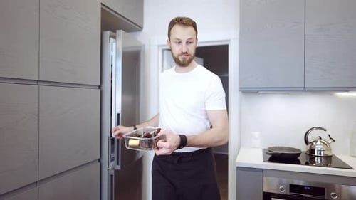 Couple Preparing Tea and Dessert in Bright Kitchen