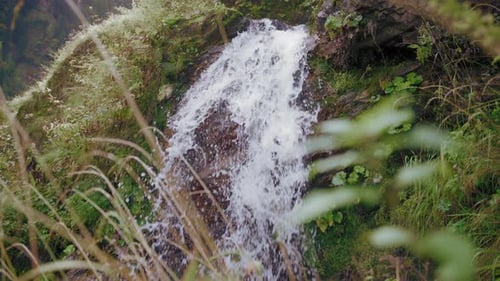 Dolly shot of small waterfall
