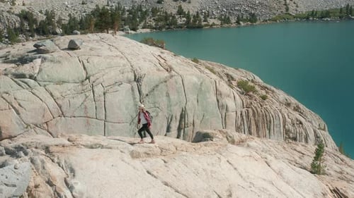Woman Hiking at Mountain Lake