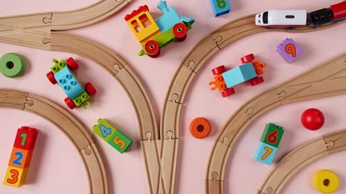 Toy Train Travels Along Tracks Among Number Blocks