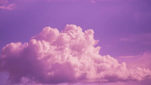 Pastel Clouds Gently Drifting in a Pink Sky
