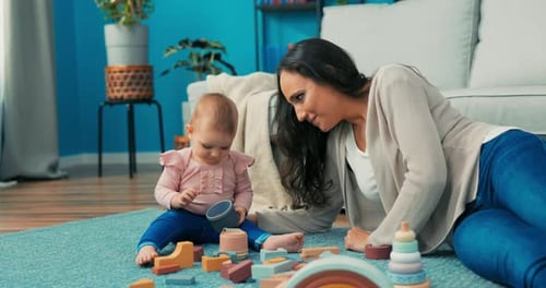 Mother and Baby Playing with Wooden Blocks