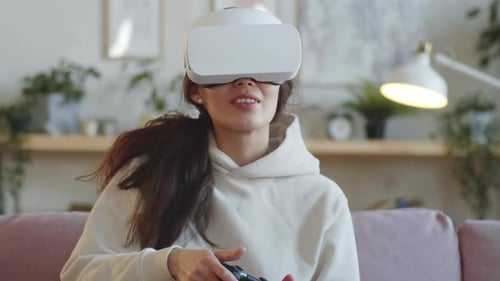 Woman Enjoys Virtual Reality Gaming at Home