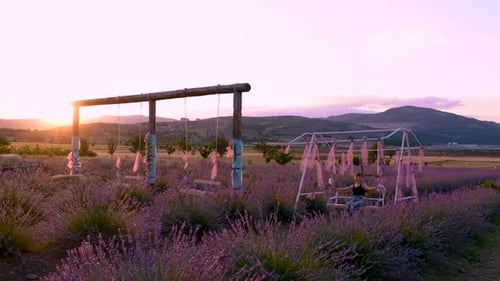 Girl Swinging on a Swing in Lavender Garden