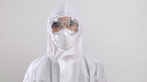Person in Protective Suit, Goggles, and Mask