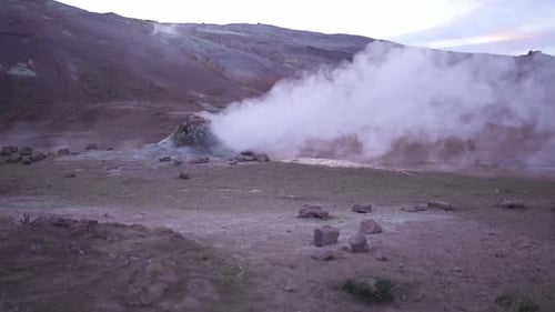 Hot spring with steam in mountains