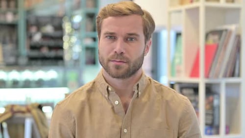 Blonde Haired Man Looking Directly at Camera