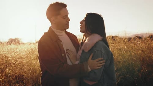 Couple Hugs Each Other At Sunset