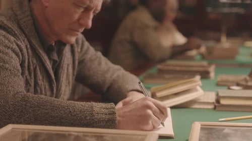 Senior Professor Working in Library