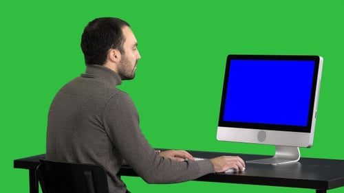 Businessman working with a computer on a Green Screen