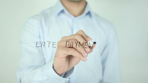 Man Writes Late Payment on Glass