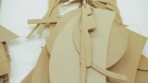 Abstract Cardboard Shapes and Pieces on Light Surface
