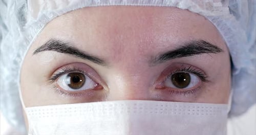 Portrait of a Close Up Woman Surgeon, Doctor With Mask Ready for Operation in Hospital or Clinic