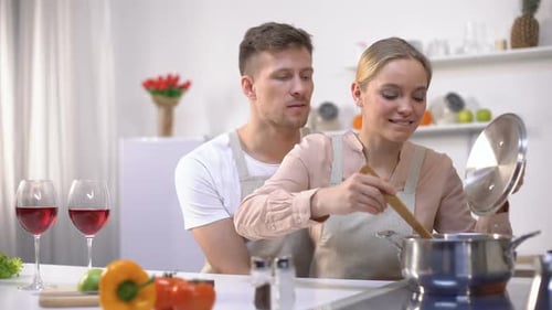 Romantic Couple Cooking Together in the Kitchen