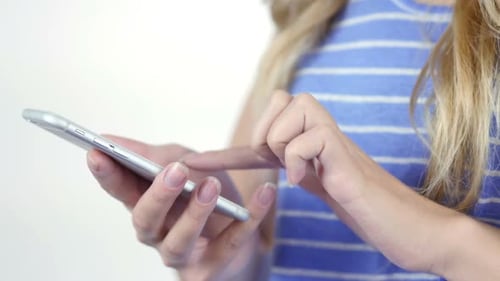Woman Typing on Smartphone Device Close Up
