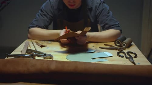 A Tanner Works Behind a Workbench