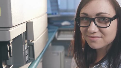 Young Woman Scientist Working with Lab Equipment