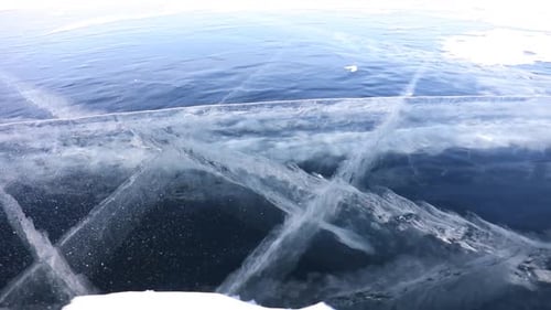 View of The Beautiful Transparent Blue Ice of Frozen Baikal Lake