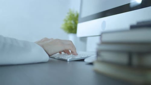 Woman Typing On Computer