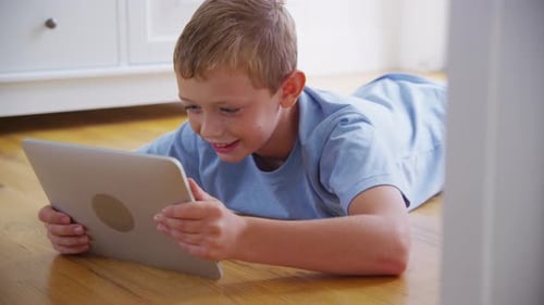 Young boy using digital tablet. Shot on RED EPIC for high quality 4K, UHD, Ultra HD resolution.