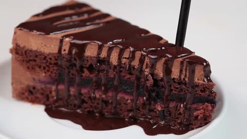 Slice of Chocolate Cake Being Eaten with Fork