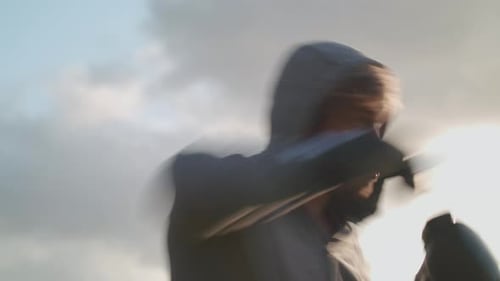 Man Boxing In The Park In The Evening Sun