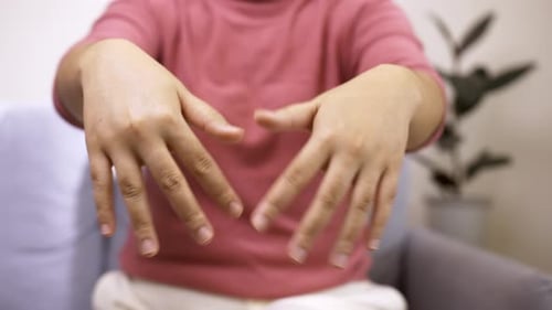 Women doing hands stretching after intense home office day protect office syndrome. Health care conc