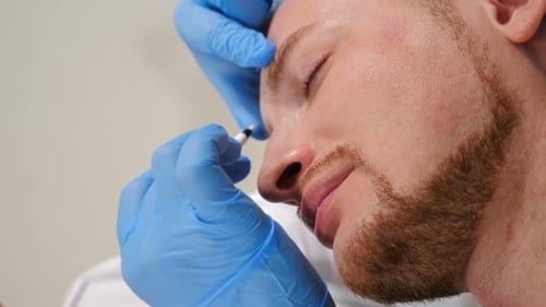 Man Receiving Cosmetic Procedure in Medical Clinic